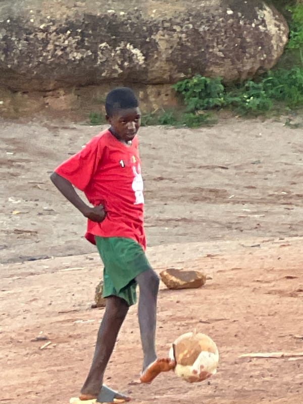 Pickup soccer on rocky ground near Jos's landmark boulders