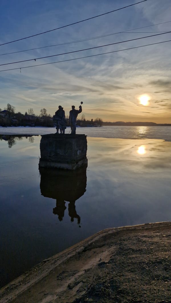Sunset waterway and dam documented in Otchor, Russia