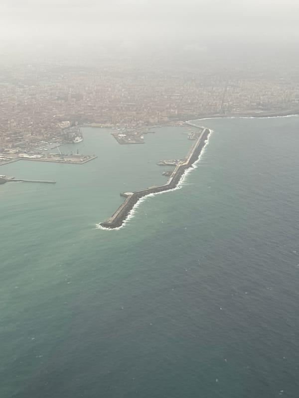 Aerial view captures Catania port breakwater at dawn