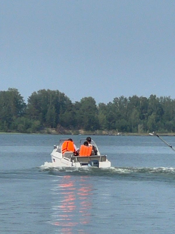 Boating and grilled fish on a summer day at Lake Borovoe