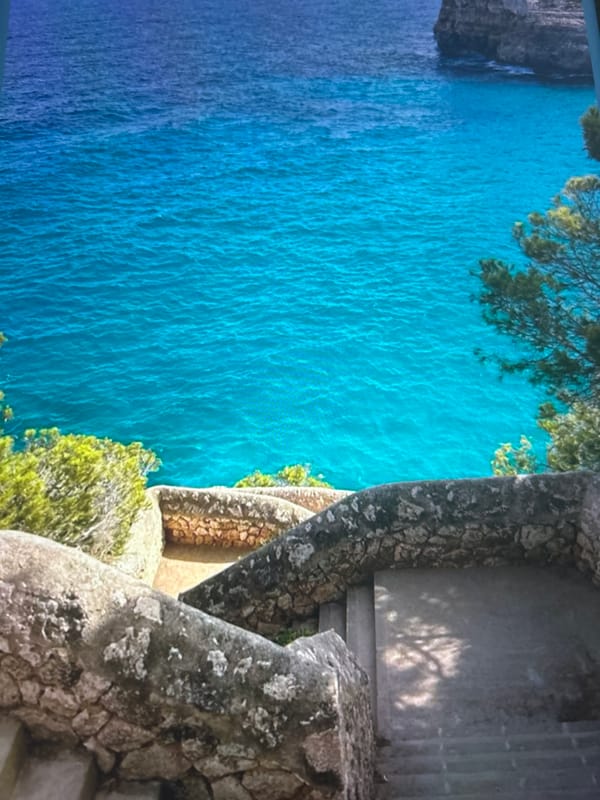 Aerial coastal bay views captured showing clear turquoise waters