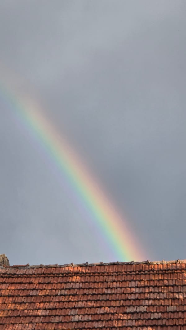 Rainbow arcs over residential Samovodene, Bulgaria