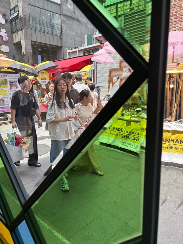 Seoul morning: art market stalls, street scenes, and a bagel café