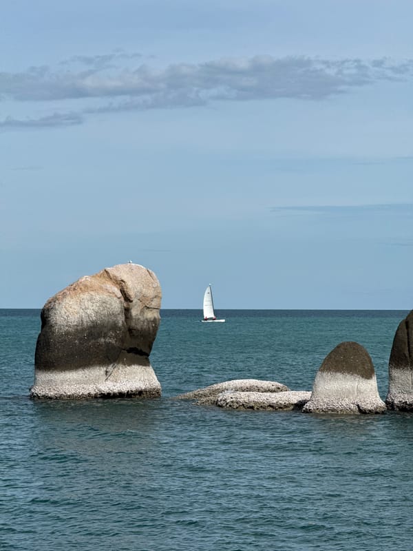Weathered rocks and teal water along Ko Samui's coast