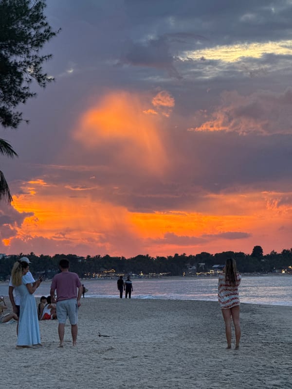 Sunset session at Arugam Bay with surfers and beachgoers