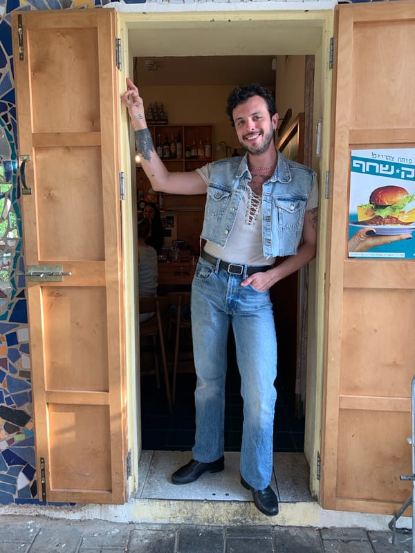 Man in denim outfit spotted in Tel Aviv doorway