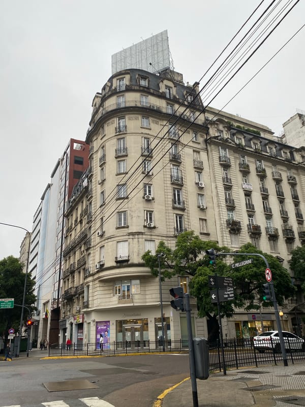 Corner building with balconies observed in Buenos Aires street