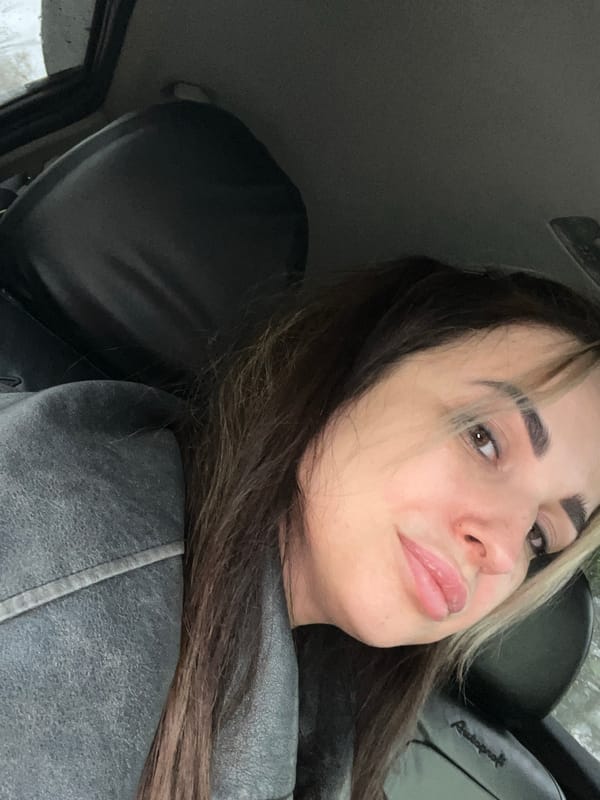 Woman documents car journey through selfies and travel moments