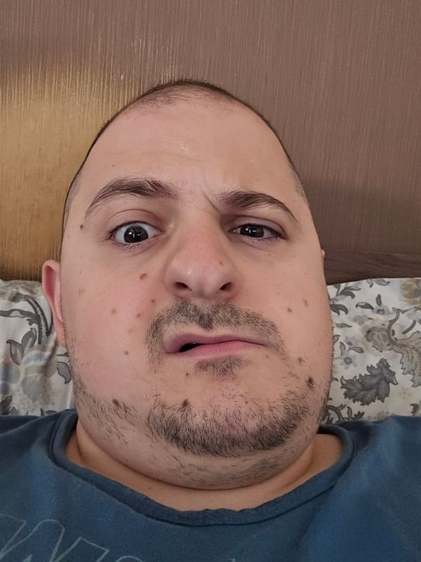 Portrait of unidentified man captured on bed