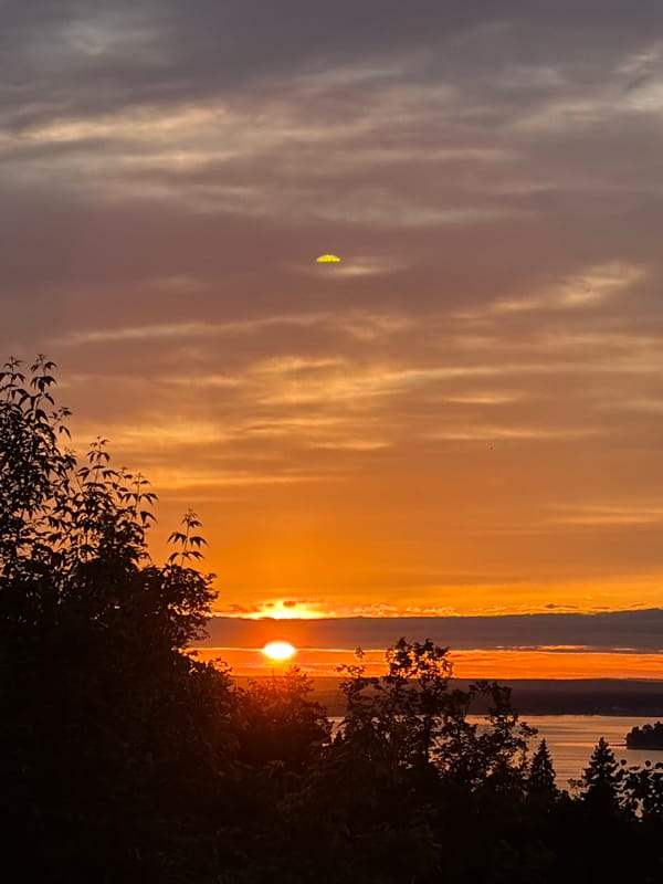 Sunset documented by witnesses over water in Izhevsk, Russia