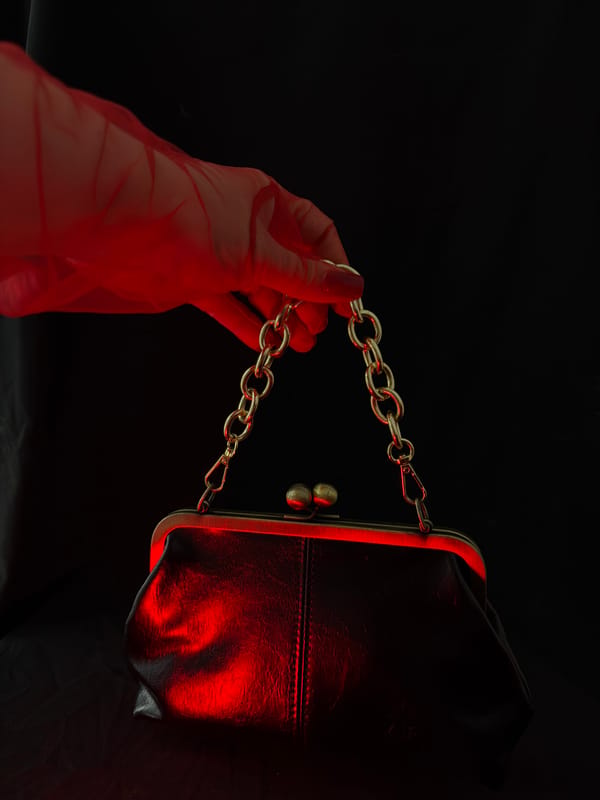 Mystical vintage accessories photographed with dramatic red lighting