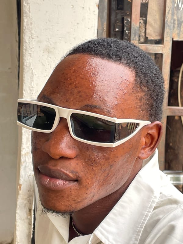 Man in white shirt observed on dirt lot in Jos