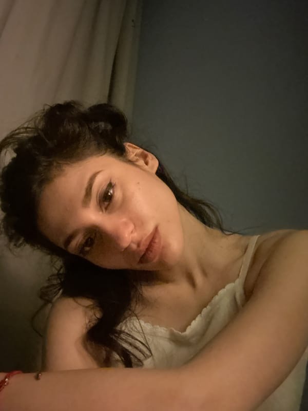 Woman documents evening photo session with pet in Sofia