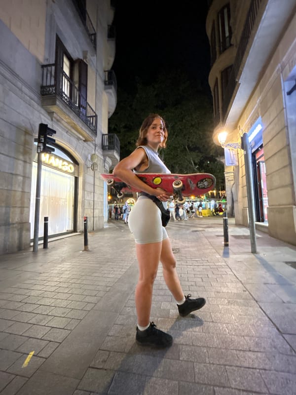 Skateboard and crescent moon, Barcelona streets at night