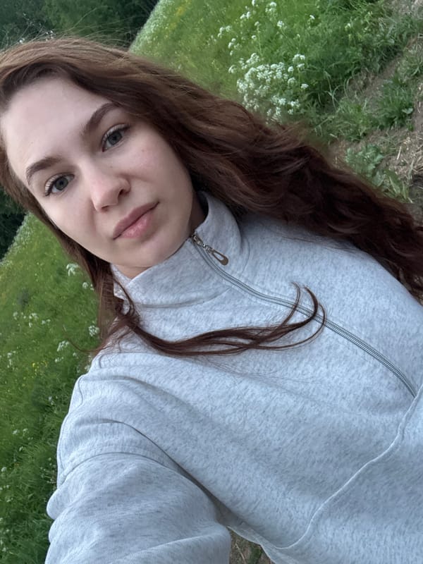 Woman documents flower garden photoshoot in rural Russia