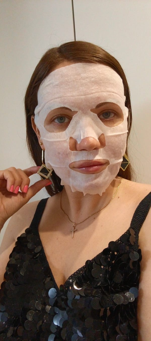 Masked woman takes selfie, herbal tea documented in Chaikovsky