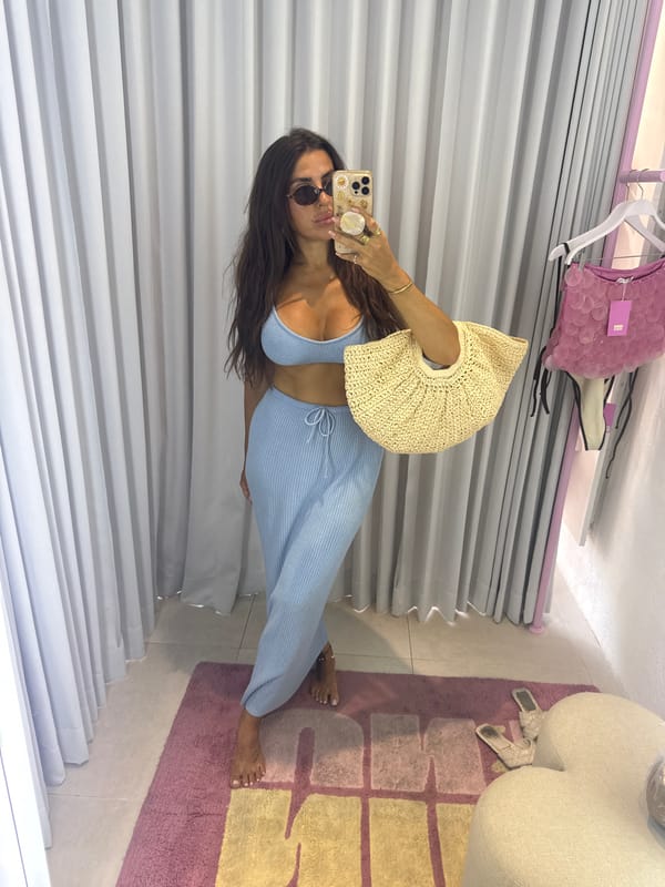 Woman takes mirror selfies in North Kuta boutique