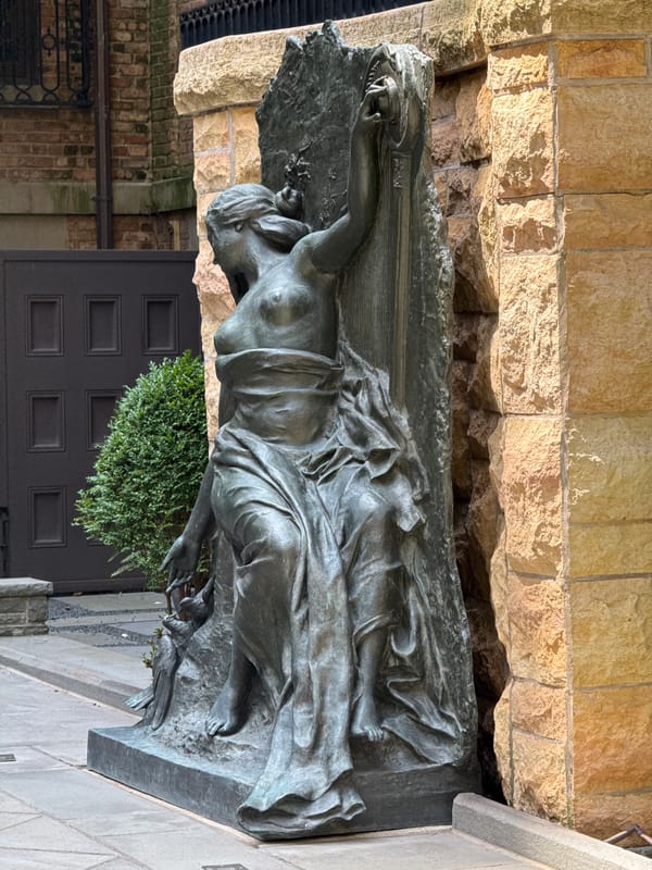Chicago streets and a bronze sculpture on a sunny afternoon