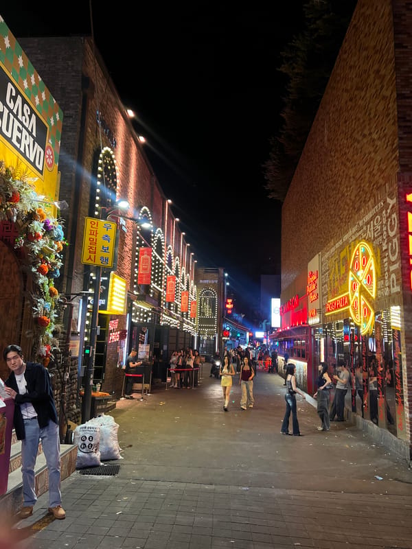 Busy crowds fill neon-lit Itaewon street in Seoul