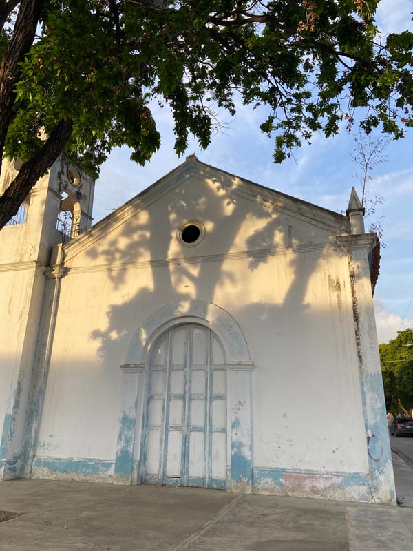 Church facade and street trees in Juan Griego, Venezuela