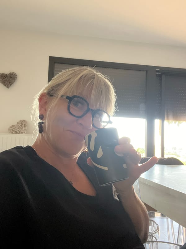 Woman with coffee mug observed in Chambœuf, France