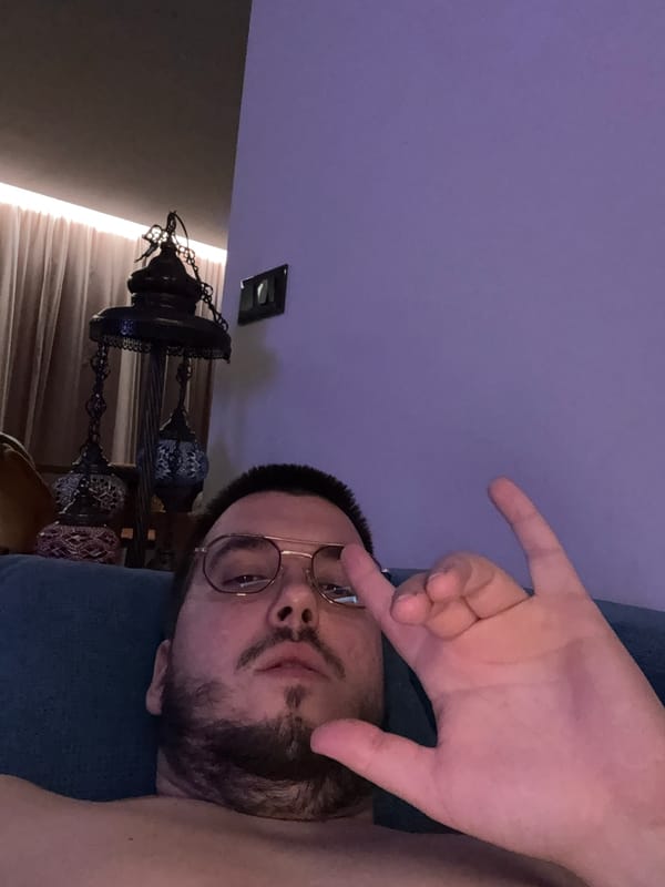 Man Makes Casual Hand Gesture Indoors in Sofia