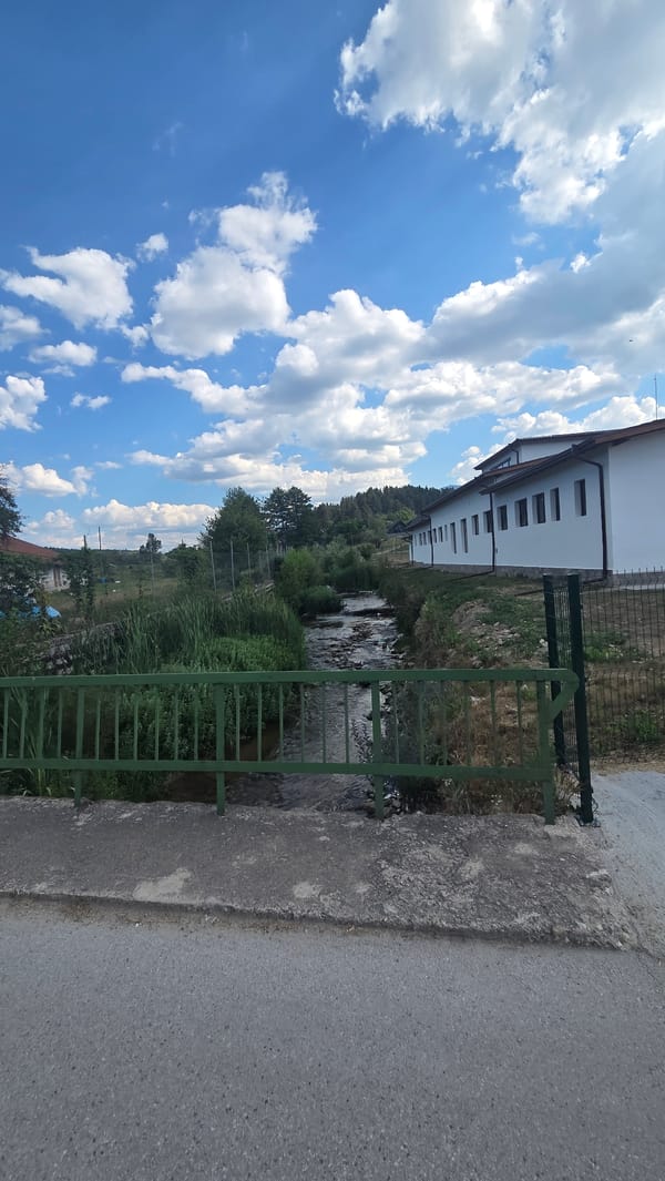 Quiet afternoon around a parking lot and stream in Bania