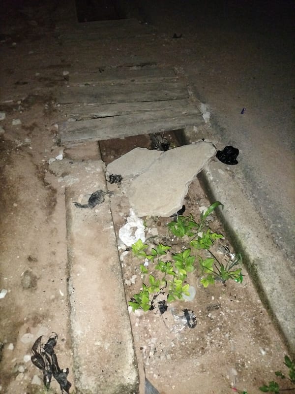 Nighttime documentation of urban Jalingo infrastructure and debris