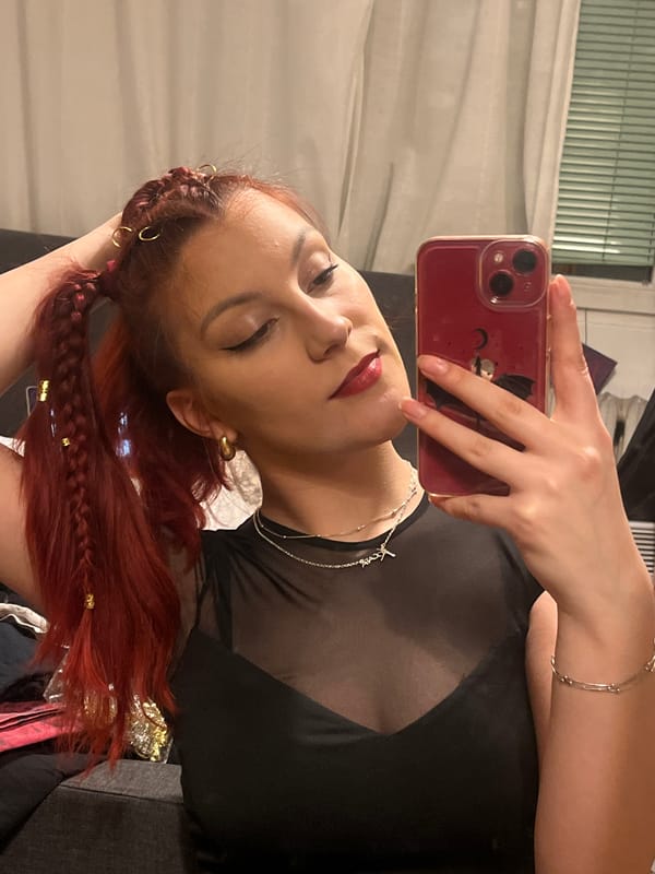 Woman takes selfies with red phone in Sofia