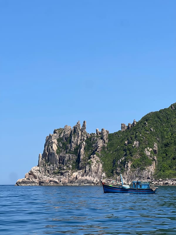 Boat day off the rugged coastline of Dai Lanh, Vietnam