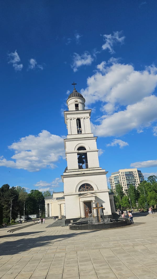 Tourist photographs captured at Chișinău landmarks under clear skies