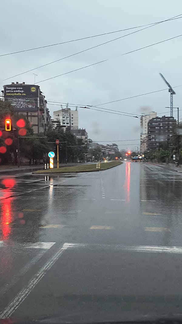 Rainy early morning street scene captured in Sofia, Bulgaria