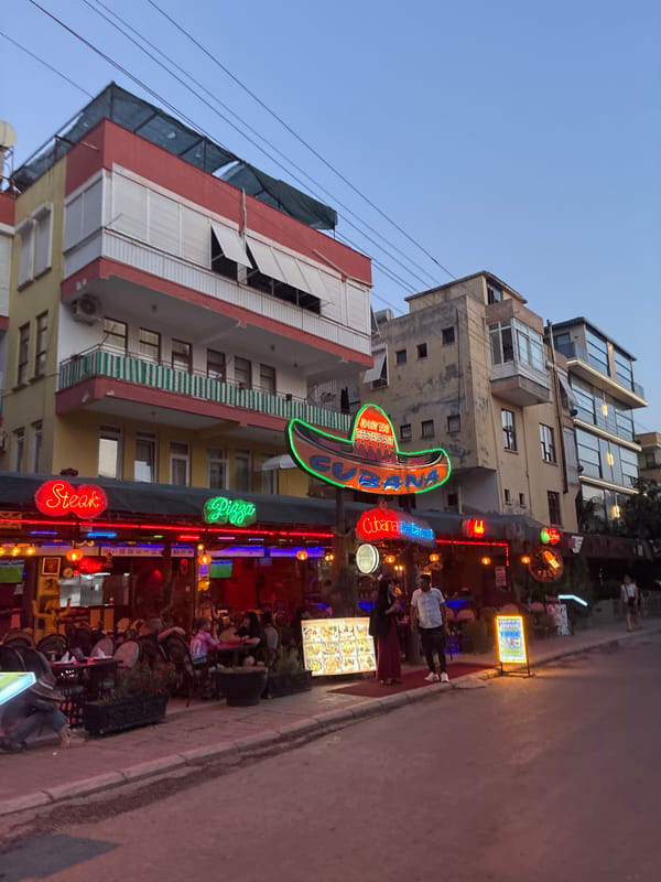 Alanya's neon-lit strip glows after evening rain