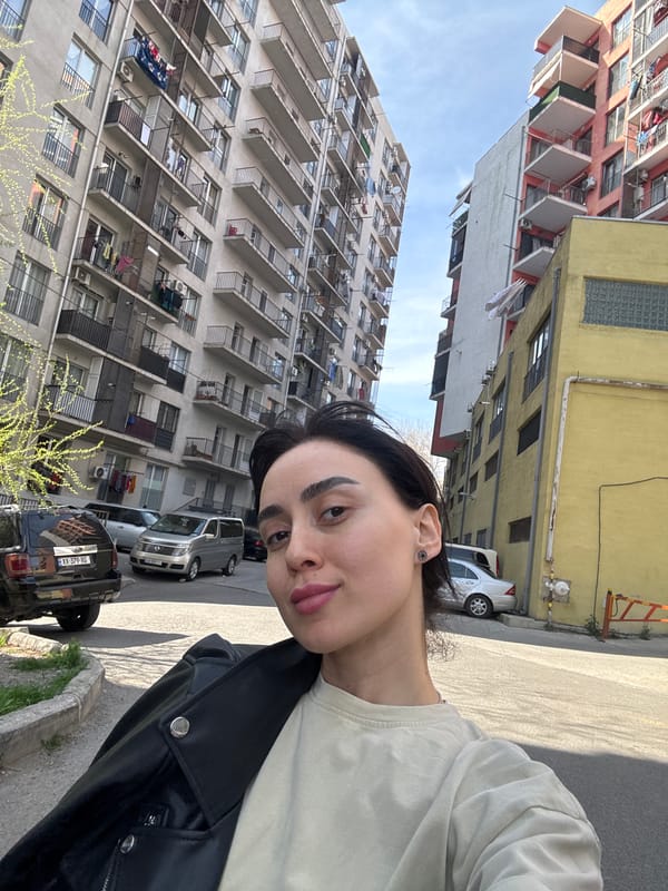 Person documents brief journey through Tbilisi with multiple selfies