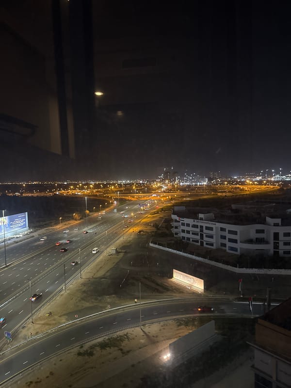 Evening traffic flows on illuminated Dubai highway