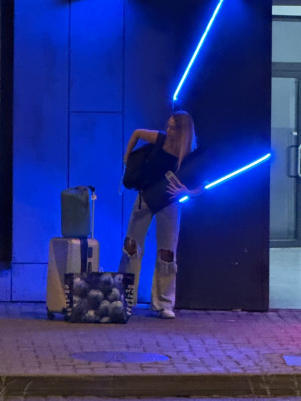 Young people walk through downtown Bratislava at night