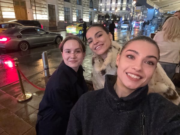 Three women take selfie together in winter clothing
