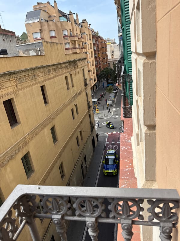 Sunny Barcelona street photographed from balcony vantage point