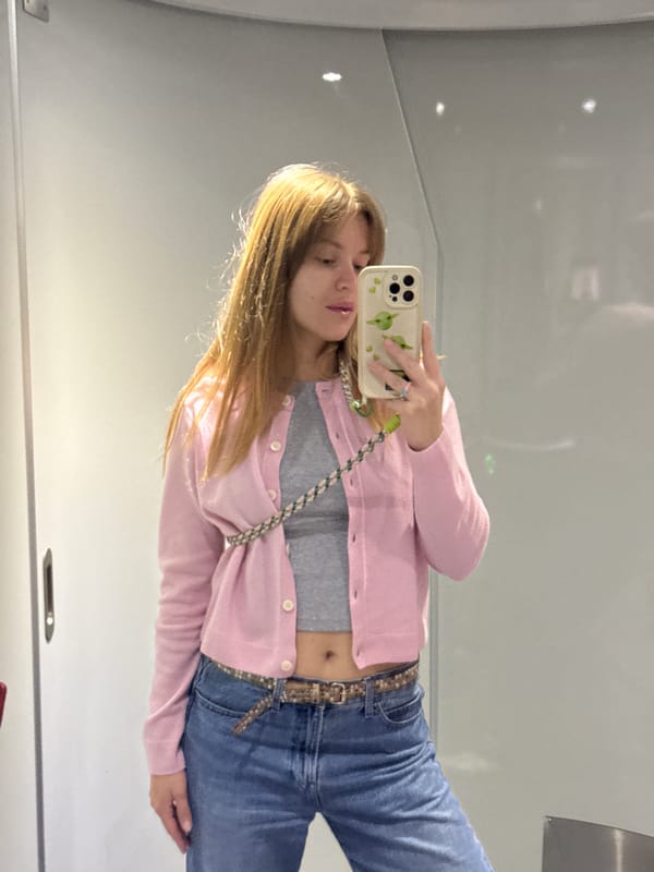 Woman takes mirror selfies in public restroom