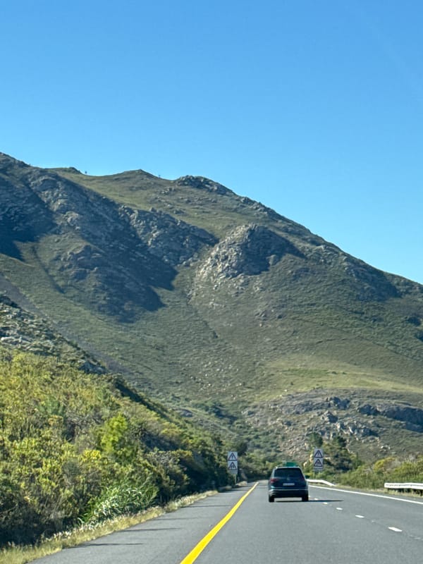 Clear skies over green mountain slopes in Lebanon, South Africa