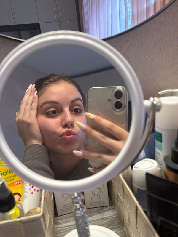 Woman takes mirror selfies in Bulgarovo bedroom