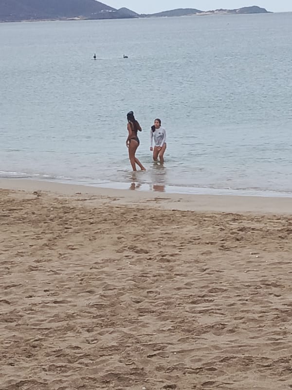 Evening beach activities documented at Juan Griego, Venezuela