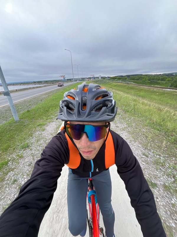 Early morning cyclist rides red bike in Chaikovsky, Russia