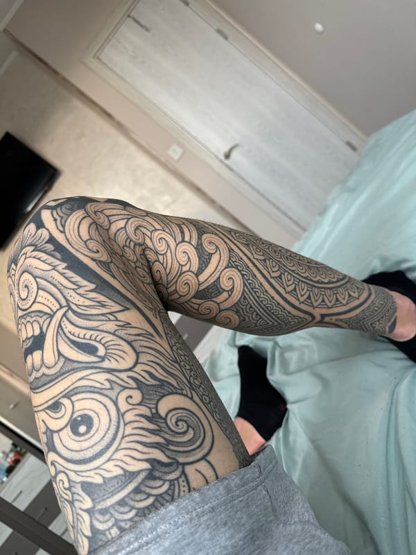 Heavily tattooed individual with glass pipe observed in Sofia