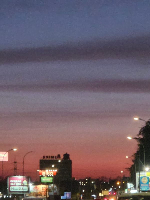 Dusk falls over Varna cityscape with illuminated streetlights