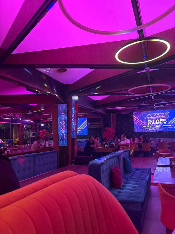 Evening scenes captured at neon-lit upscale lounge venue