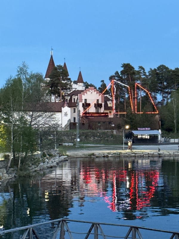 Evening lakefront lighting display documented at Lake Turgoyak, Russia