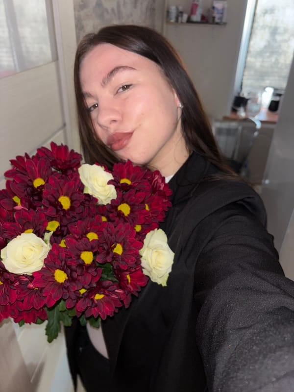 Woman photographed with flower bouquet in Perm, Russia
