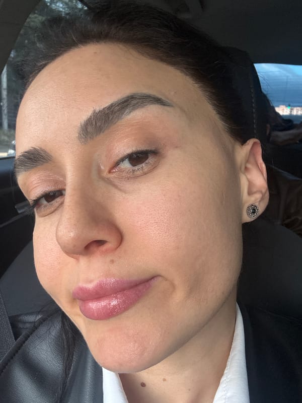 Woman photographed in car wearing leather jacket in Tbilisi