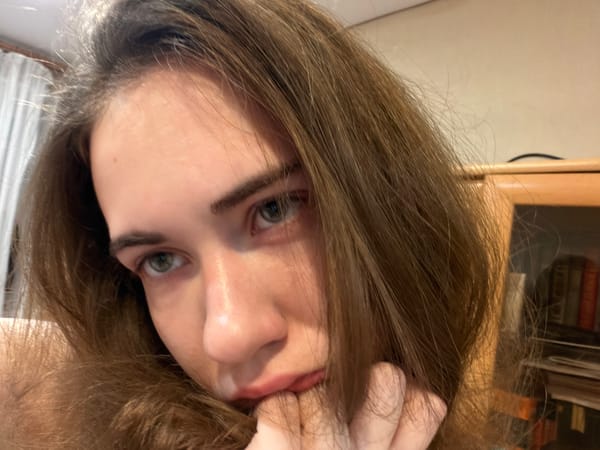 Casual indoor selfie session across a Tyumen afternoon